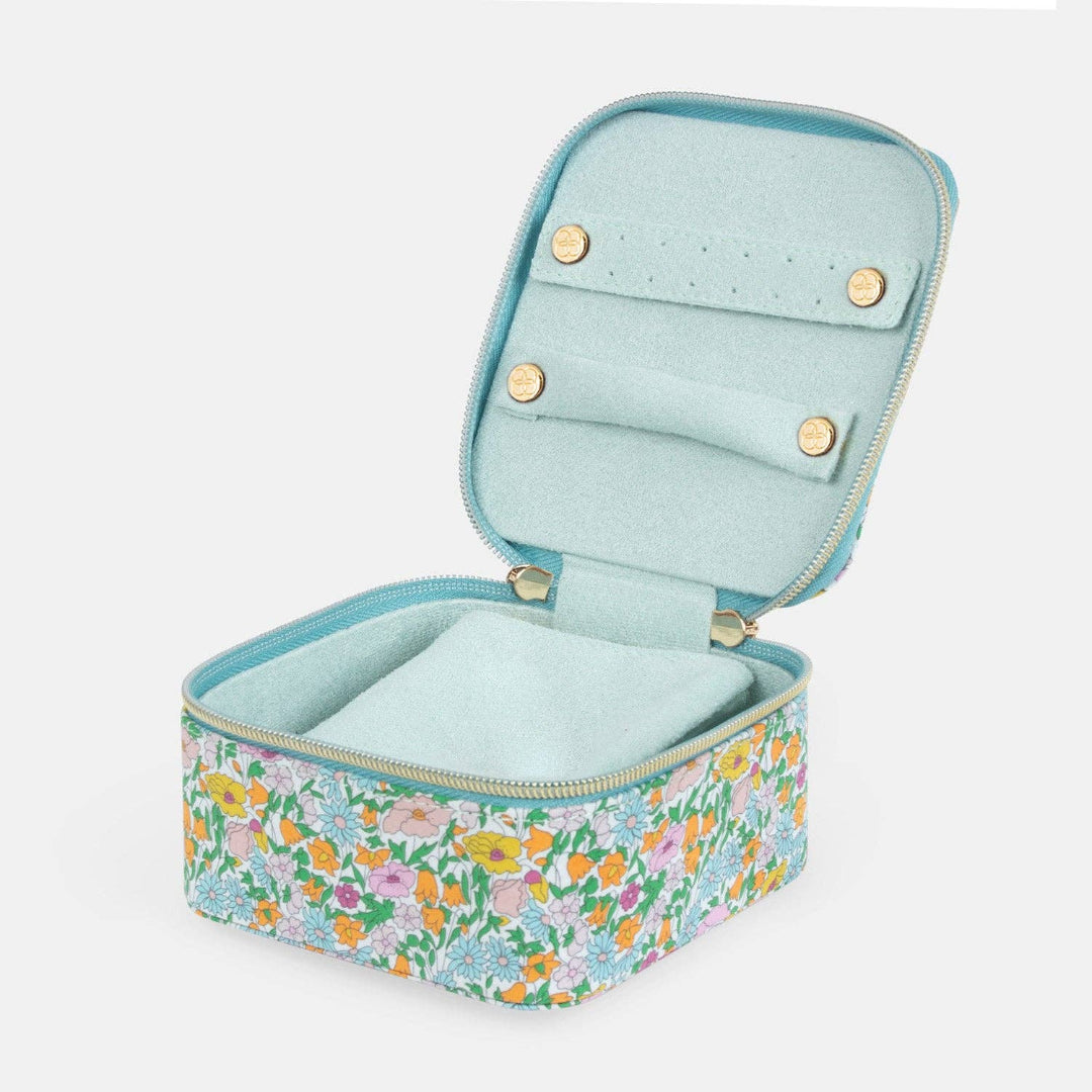 Floral-patterned jewelry case with a light blue interior on a white background