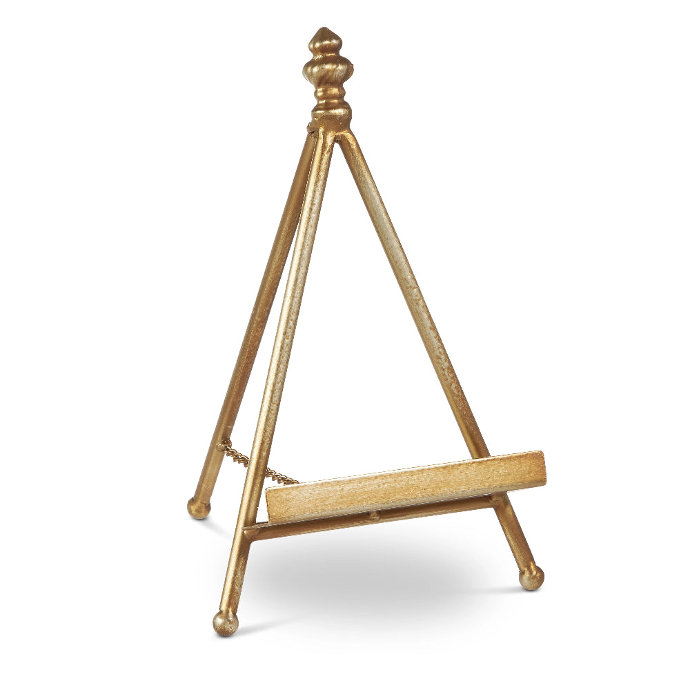 Gold metal easel on a white background