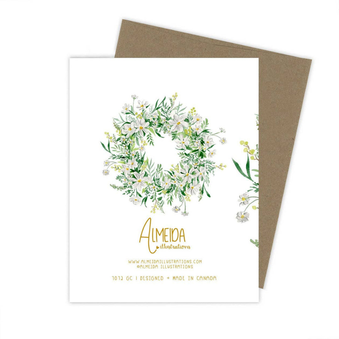Greeting card with floral design and brown envelope on white background