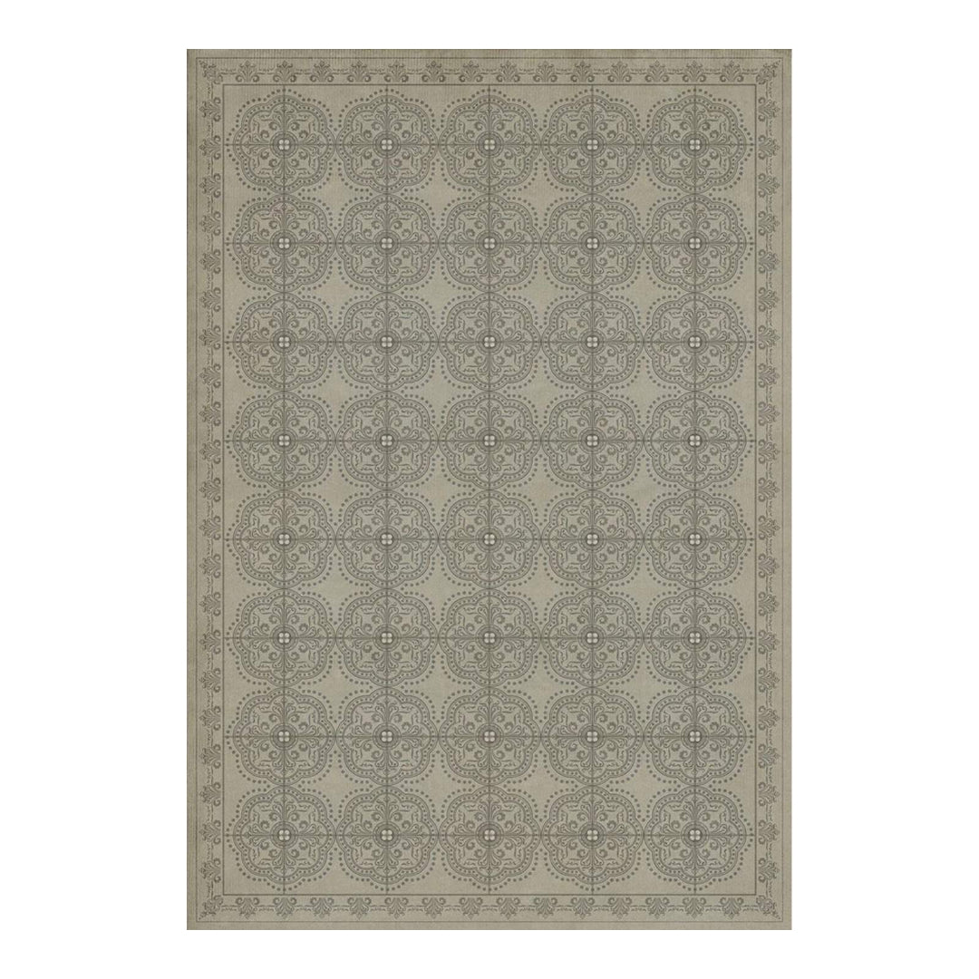 Patterned rug with geometric design on a plain background