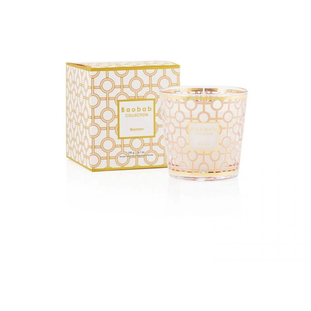 Decorative candle with matching packaging on a white background