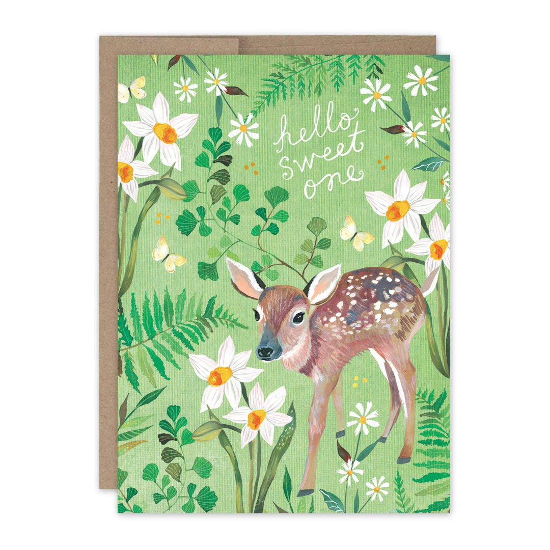 Greeting card with a deer illustration and floral design on a green background