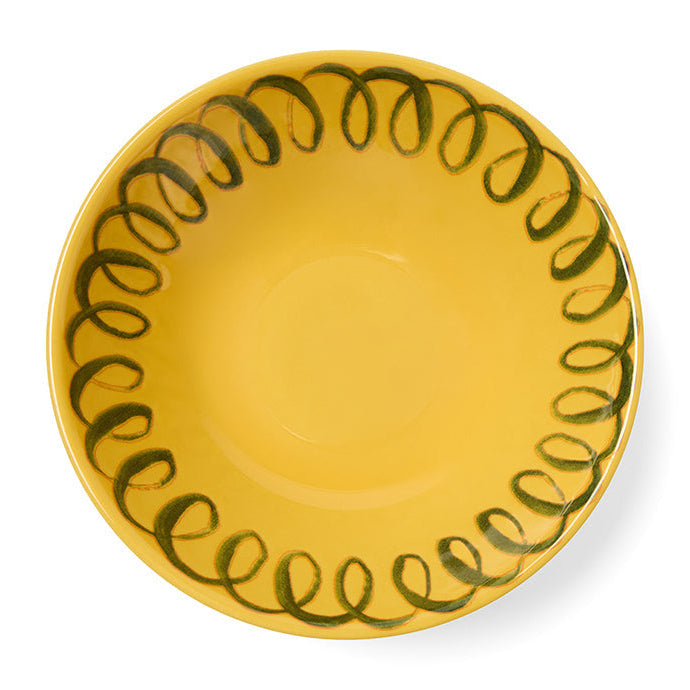 Yellow plate with green decorative edge on a white background