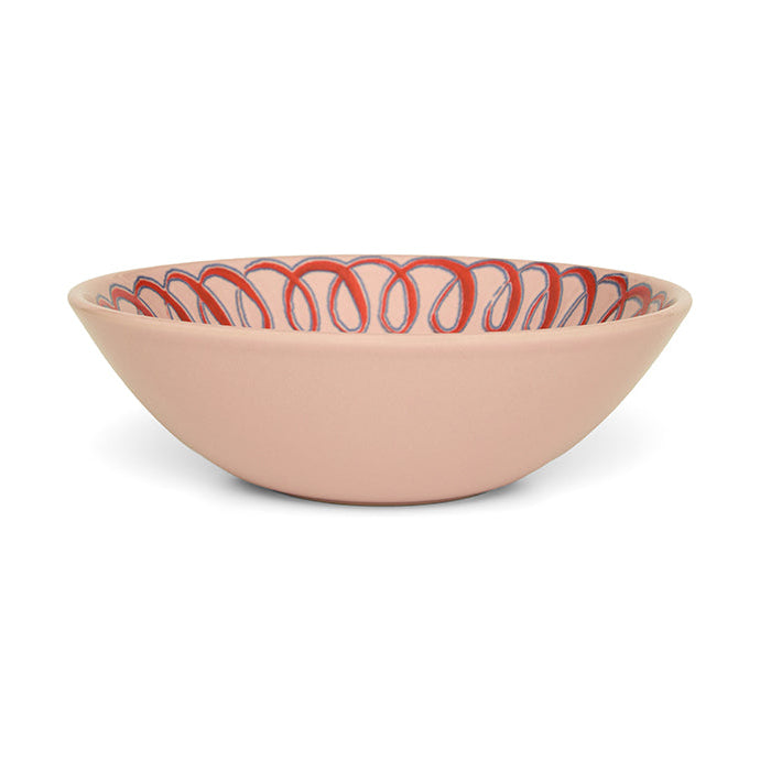 Pink ceramic bowl with pattern on a white background