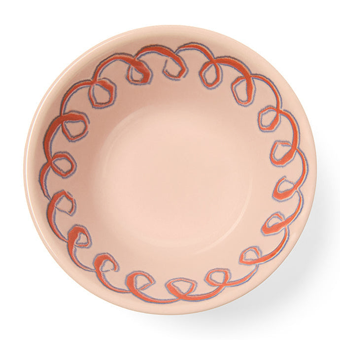 Ceramic bowl with decorative pink pattern on a white background