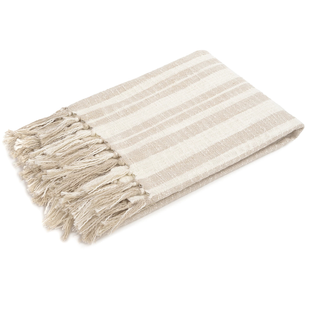 A beige and white striped cotton throw blanket with tassels.