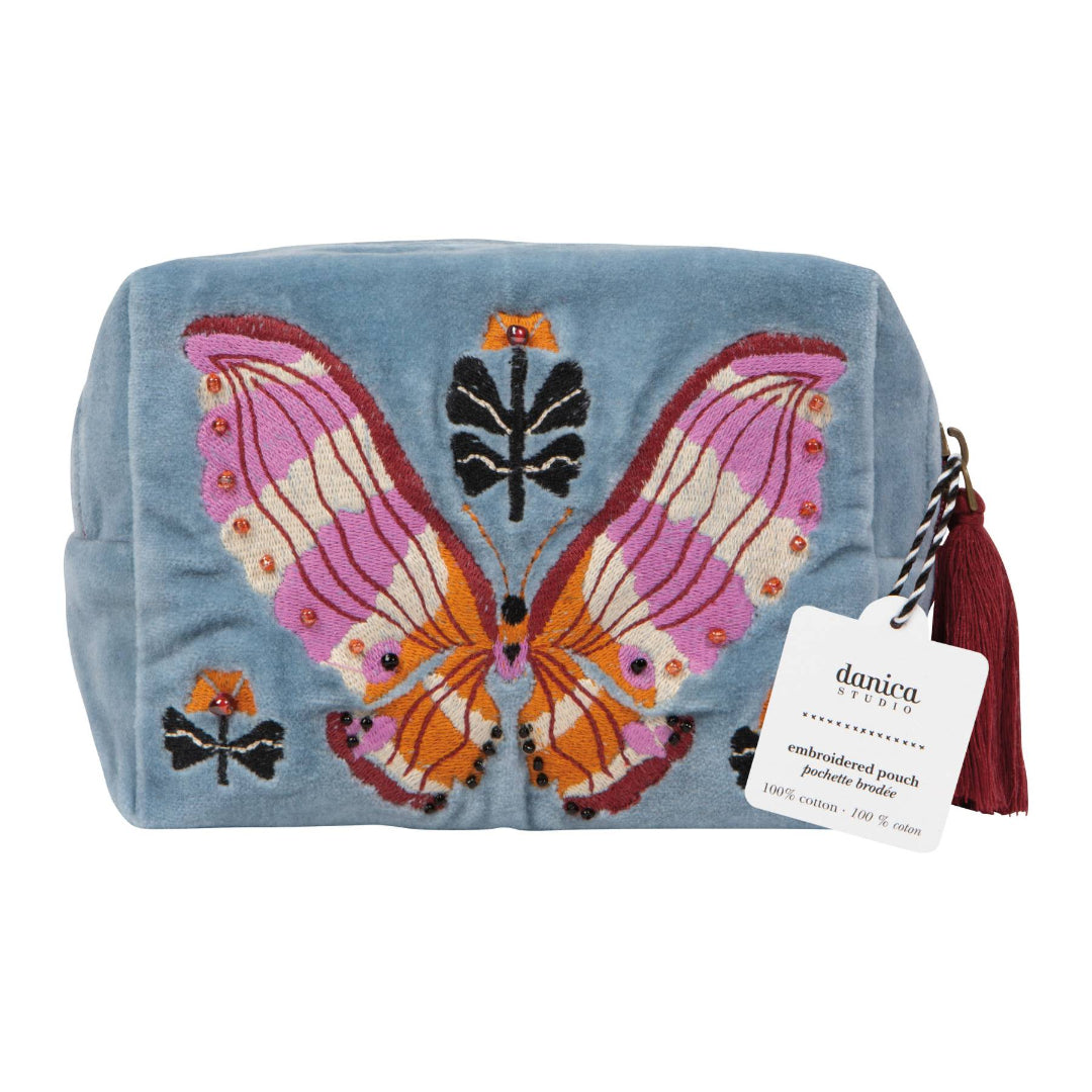 Embroidered pouch with butterfly design on a blue background, featuring a Danica brand tag.