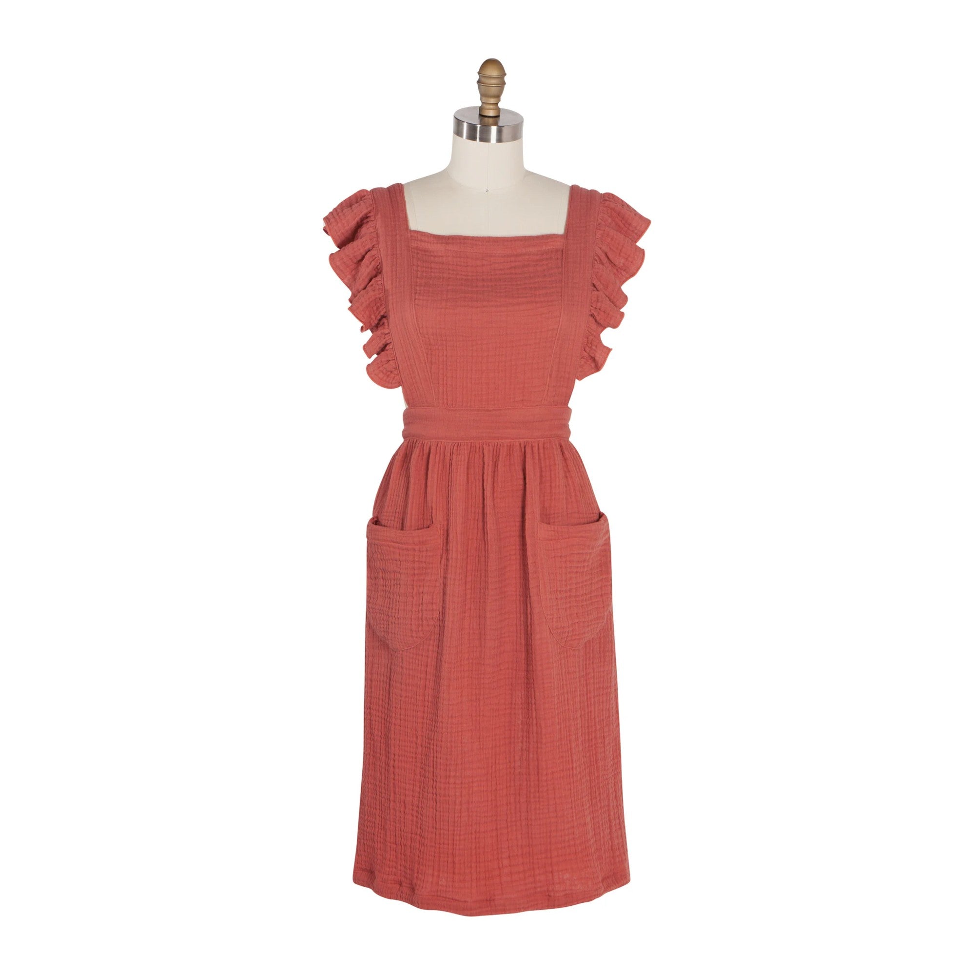 Red dress on a mannequin against a white background