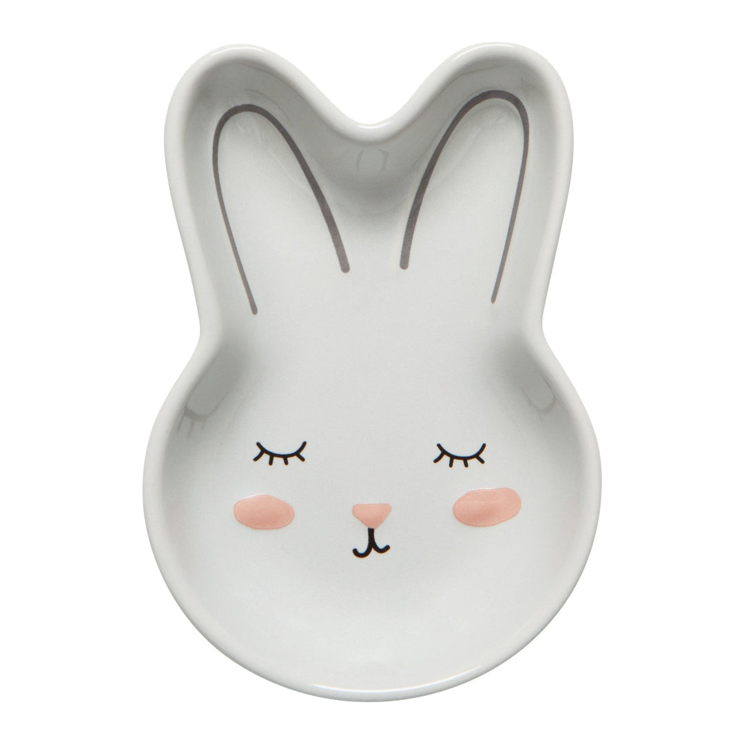 Ceramic rabbit-shaped bowl with a face on a white background