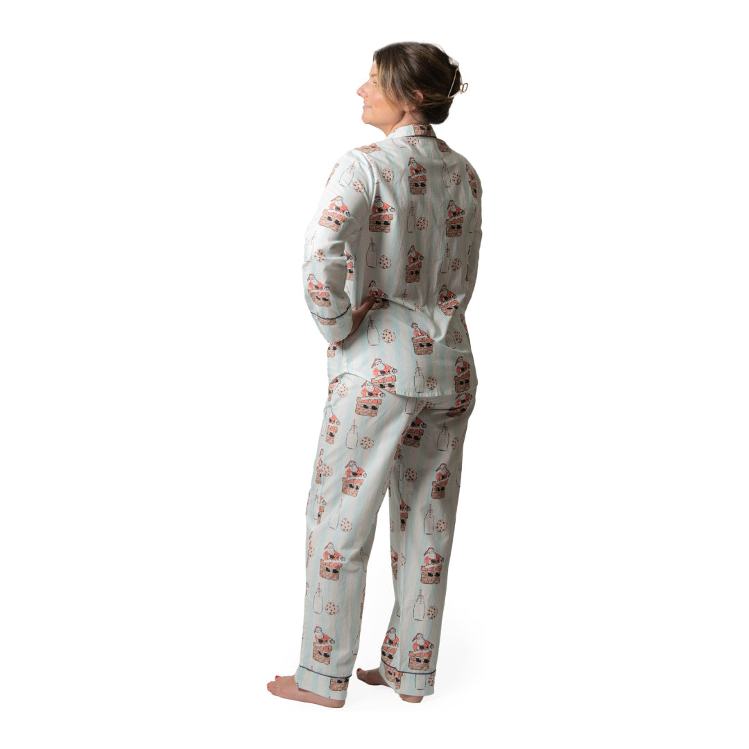 Person wearing a patterned pajama set on a white background