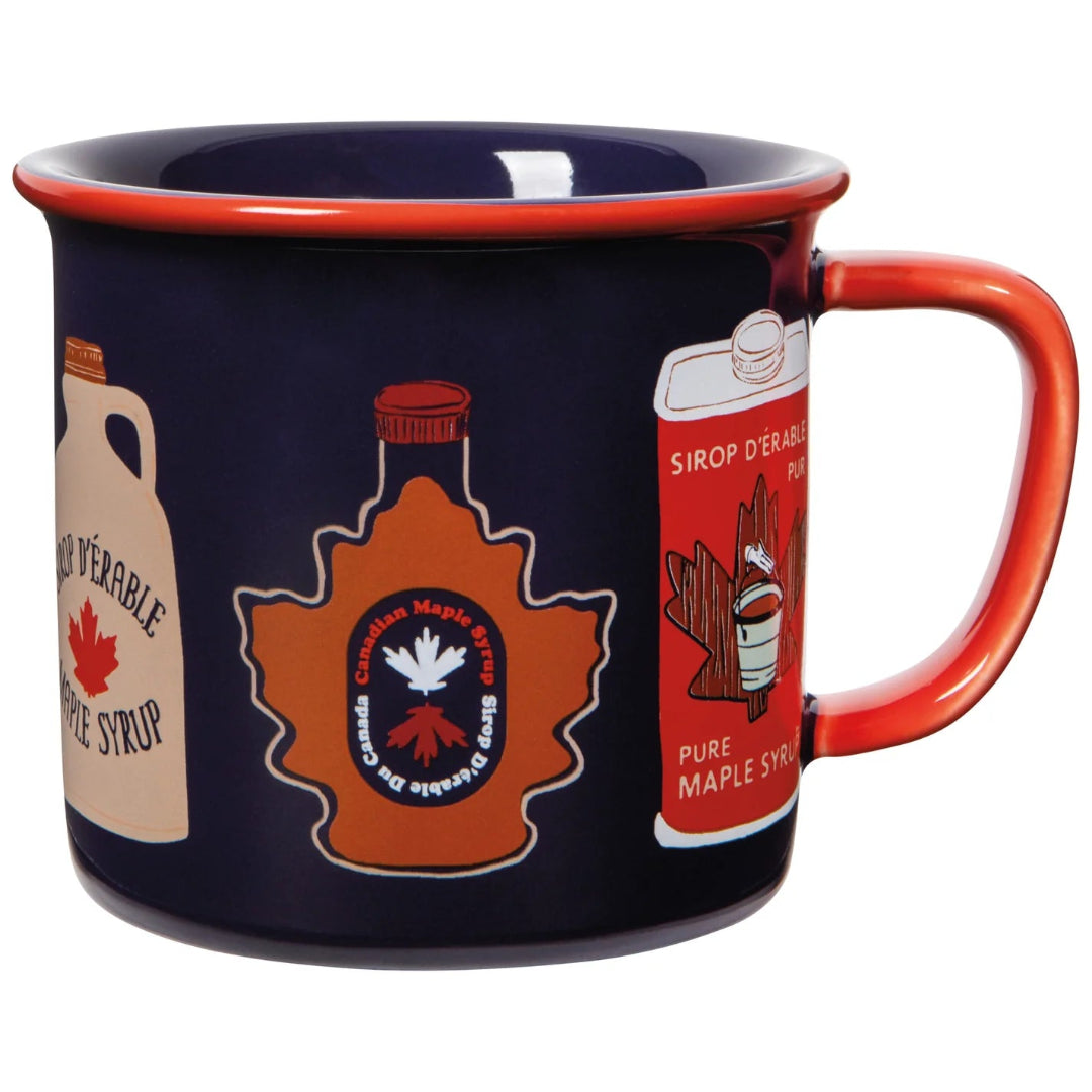 A dark navy blue enamel mug with a red handle and rim, decorated with vintage Canadian maple syrup bottles.