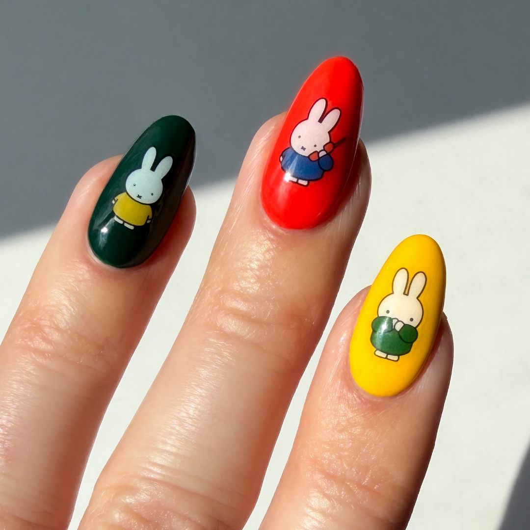Nails with Miffy character design on a neutral background