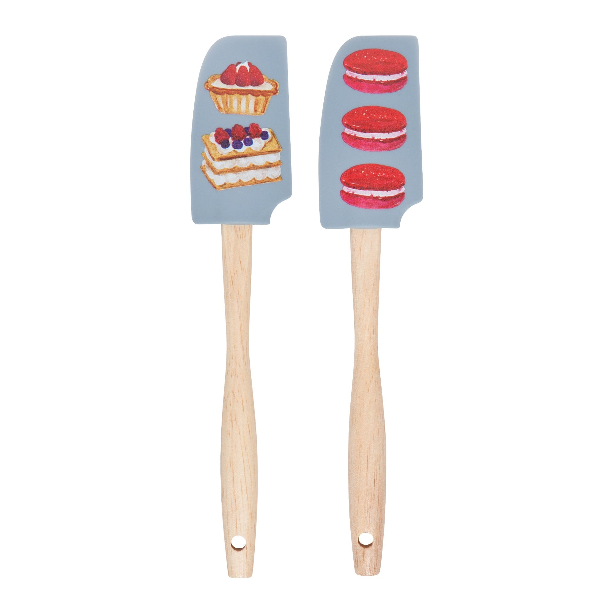 Two spatulas with dessert-themed silicone ends on a white background