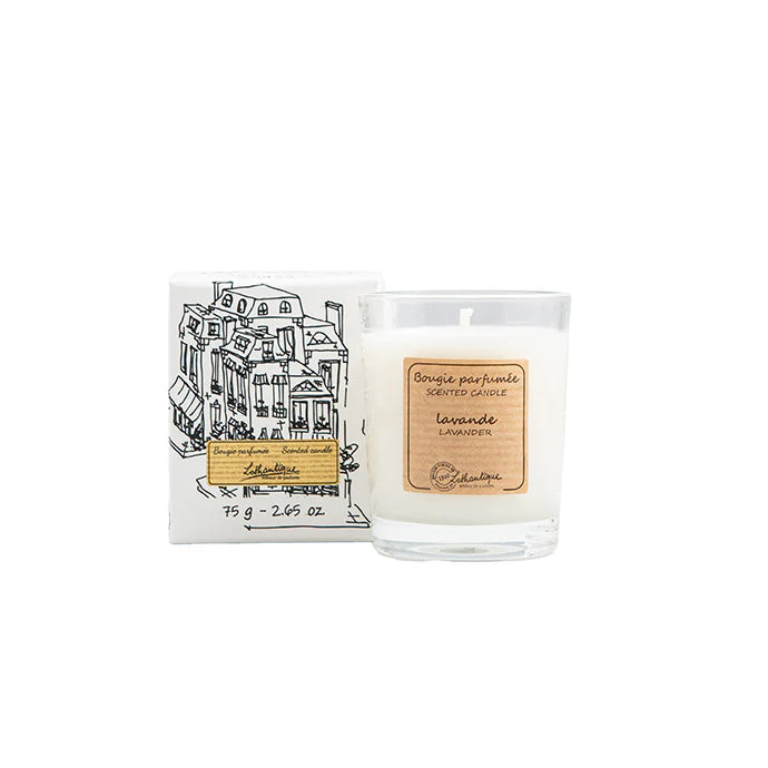 Candle with packaging featuring a building illustration on a white background