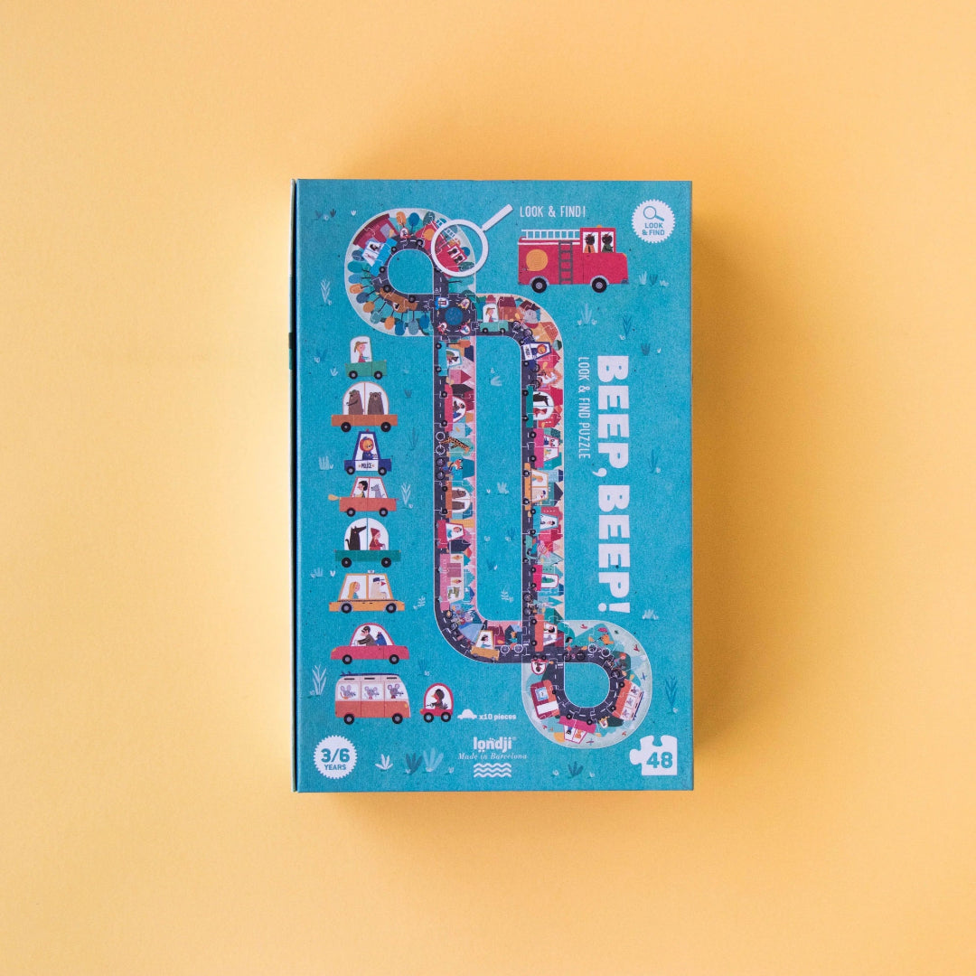 Children's puzzle box with colorful design on a yellow background