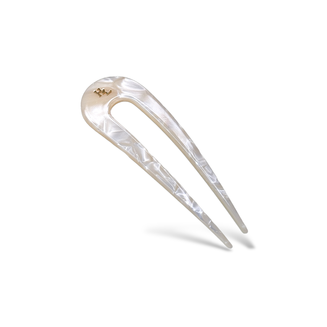 Acetate white pearly hair pin on a white background