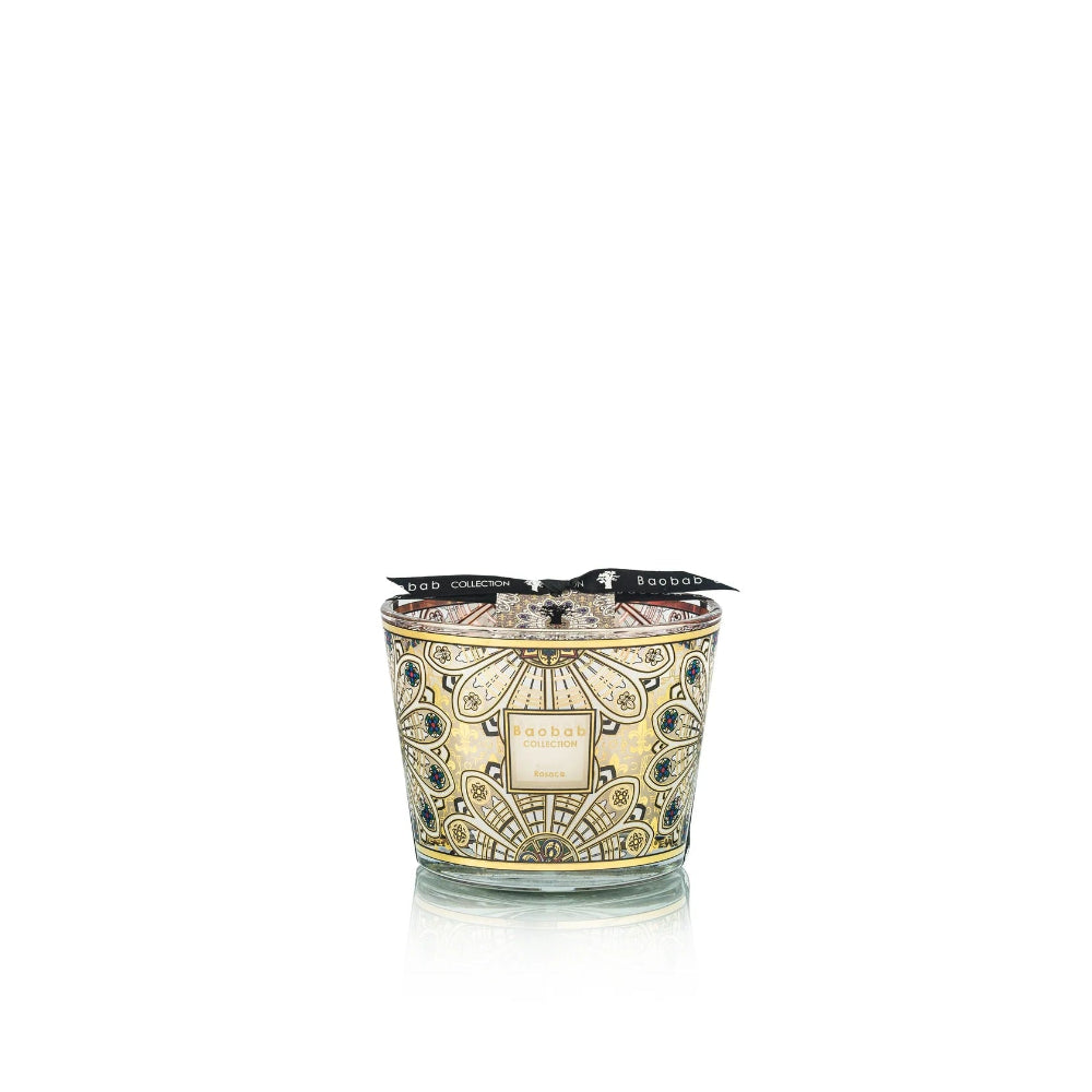 Decorative candle with intricate design on a white background