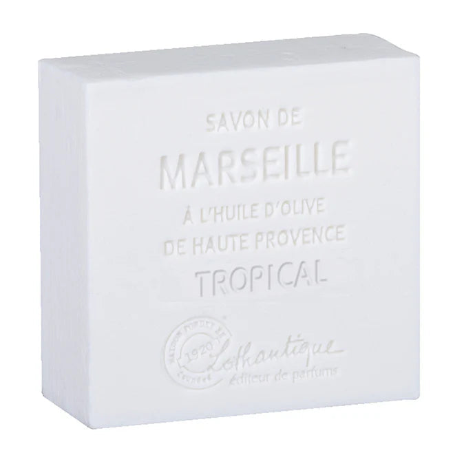 A white rectangular bar of Marseille soap with embossed text reading 'SAVON DE MARSEILLE', 'A L'HUILE D'OLIVE DE HAUTE PROVENCE', and 'TROPICAL', plus a faint brand mark near the bottom, shown on a white background.