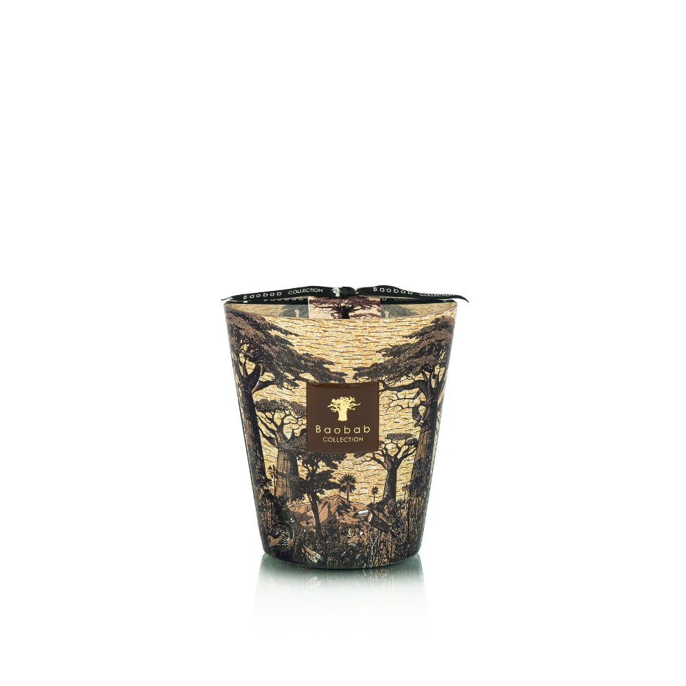 Candle in a decorative container with a pattern on a white background