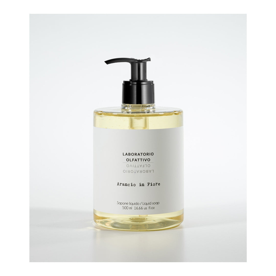 Liquid soap bottle with pump on a white background