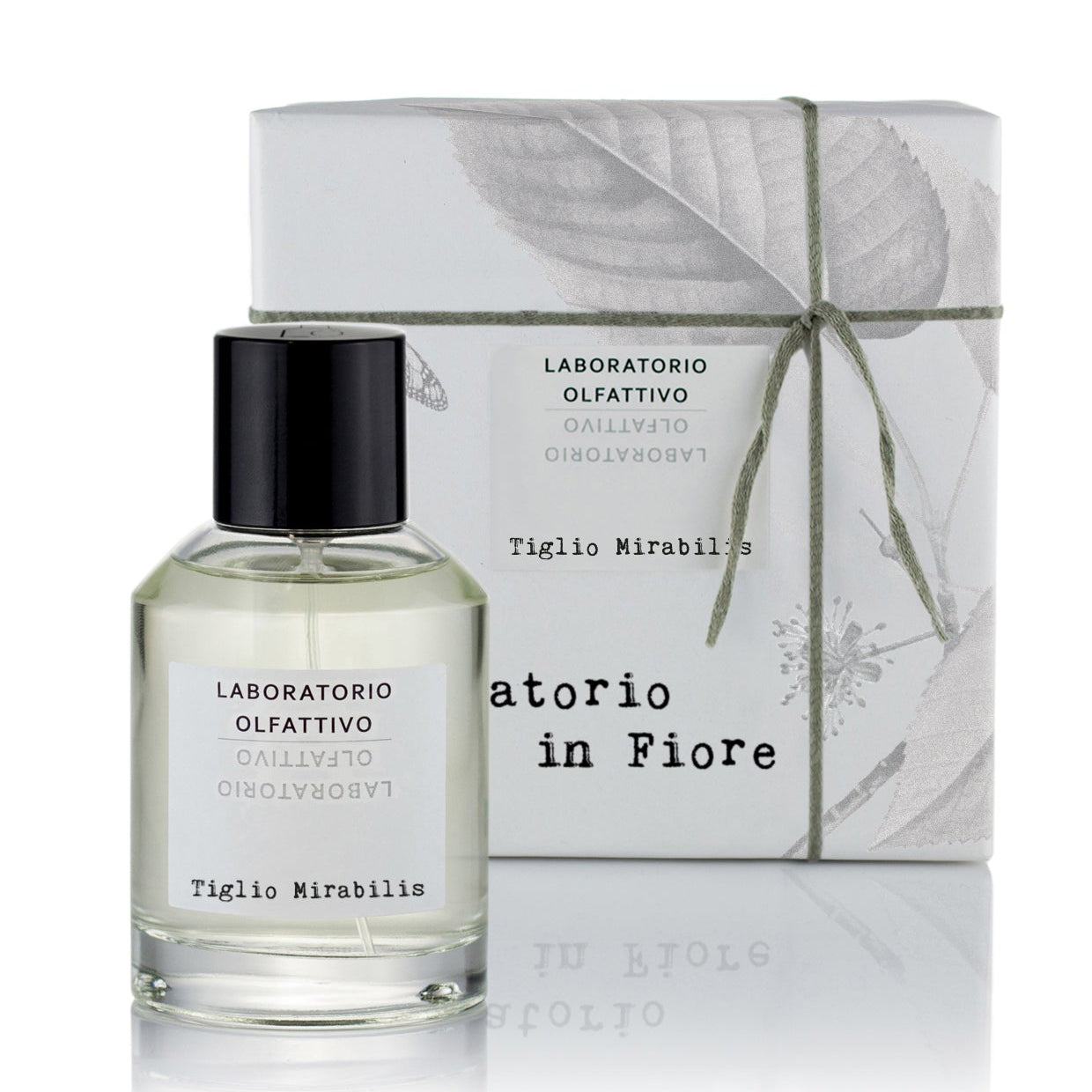 A bottle of Tiglio Mirabilis Eau de Parfum by Laboratorio Olfattivo, placed in front of its packaging box adorned with a leaf design.