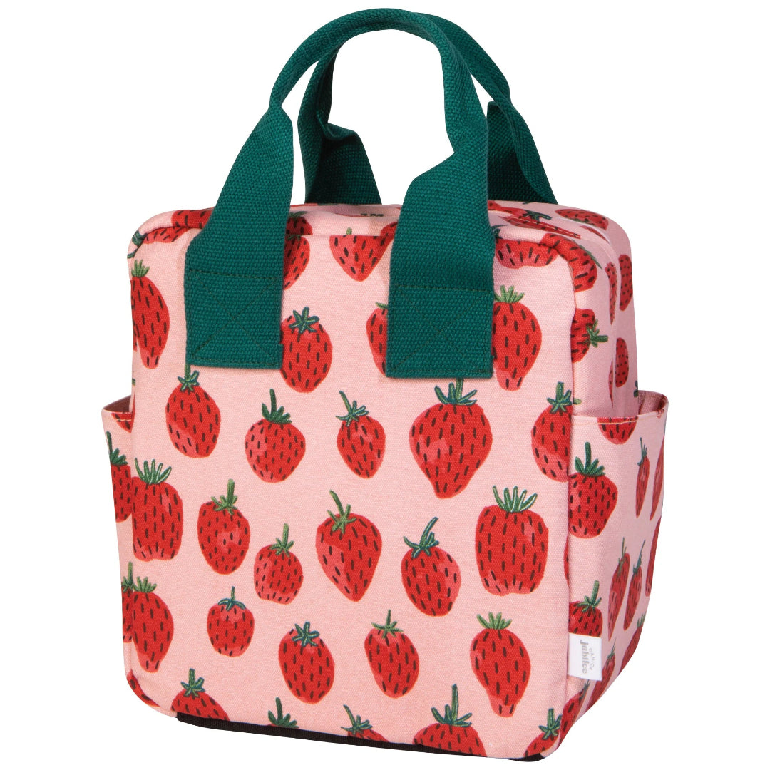 Bag with strawberry pattern and green handles on a white background