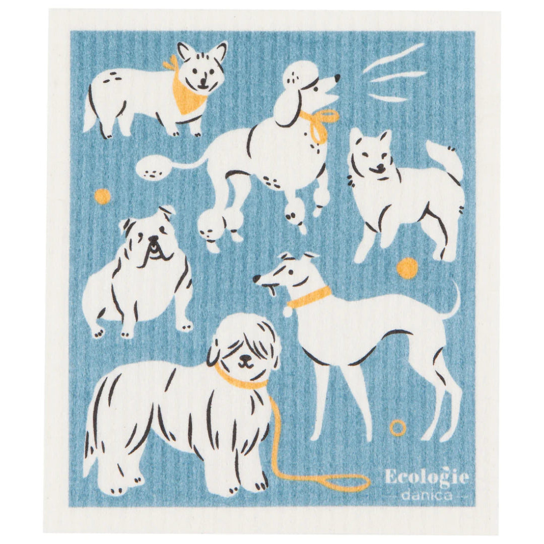 A blue and white Swedish dishcloth featuring a playful graphic of various cartoon dogs, with the brand 'Ecologie' at the bottom.