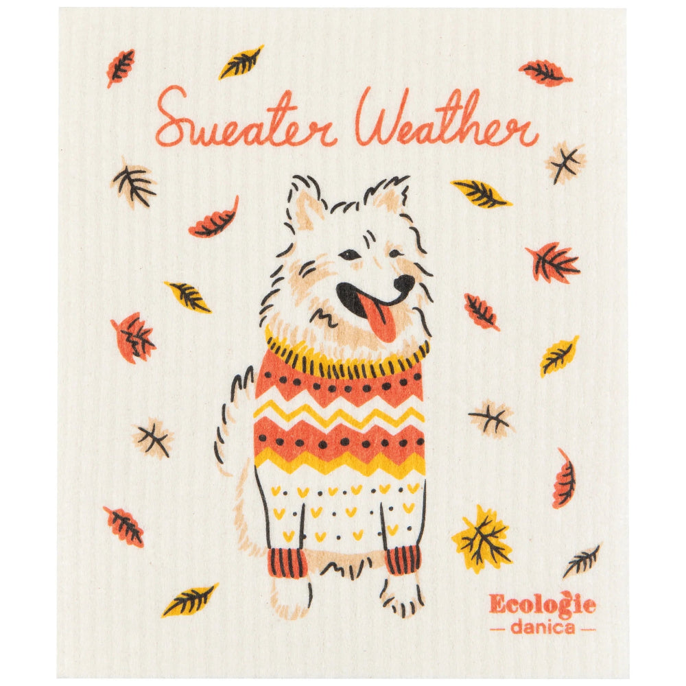 Dog wearing a sweater with autumn leaves on a 'Sweater Weather' background, featuring the brand 'Ecologie danica'.