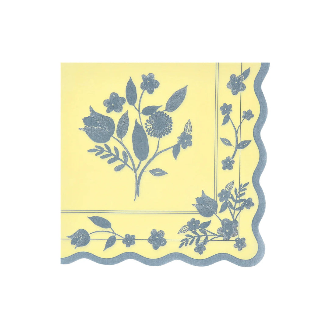 Yellow napkin with blue floral pattern on a white background