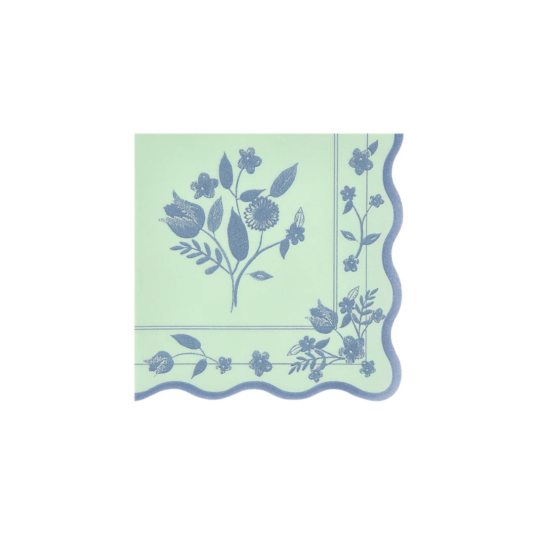 Decorative paper napkin with floral pattern on a light green background