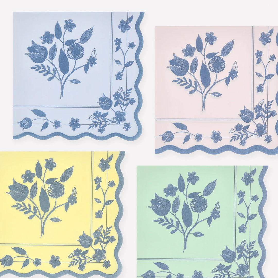 Four square napkins with floral patterns in pastel colors