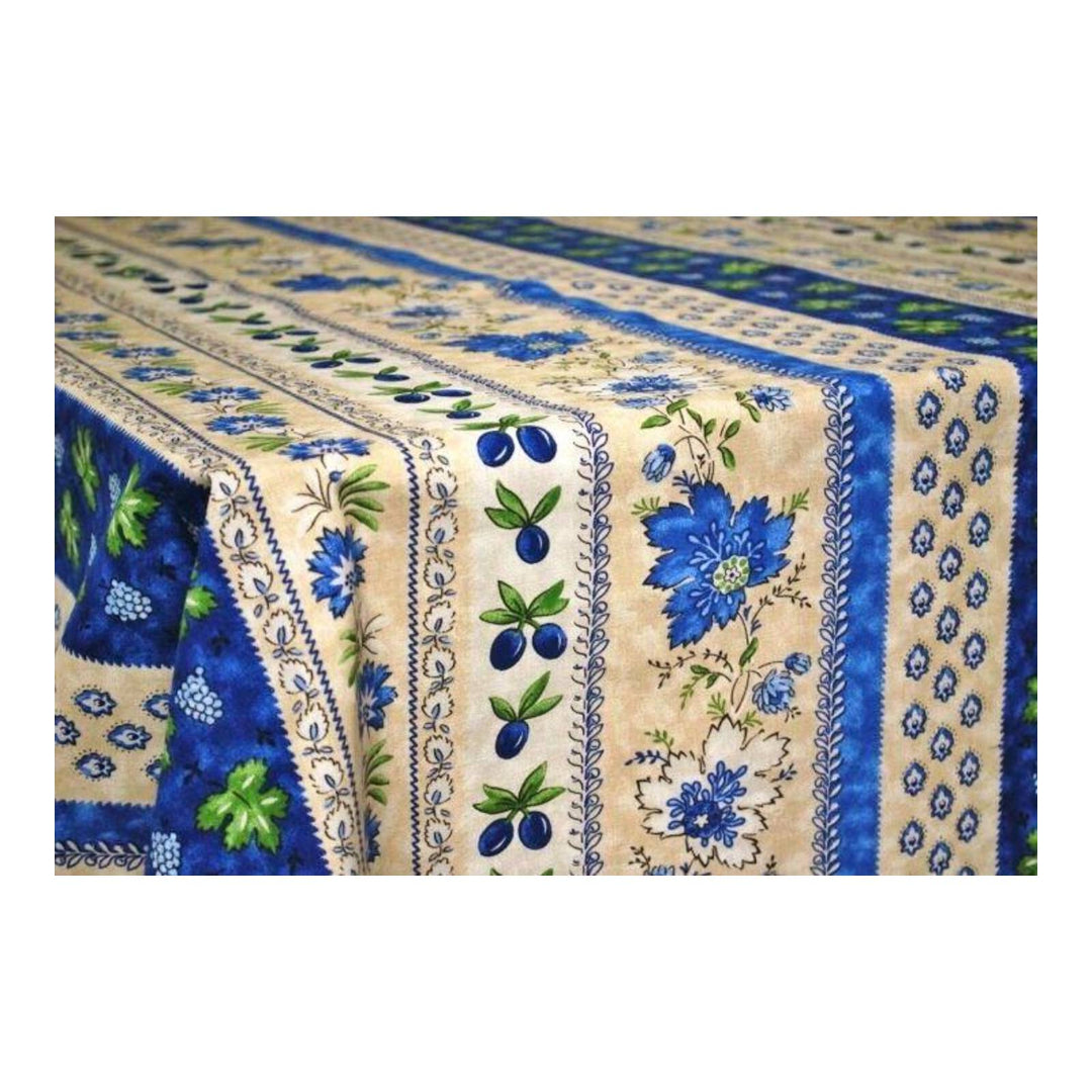 Decorative tablecloth with blue floral and leaf patterns on a white background