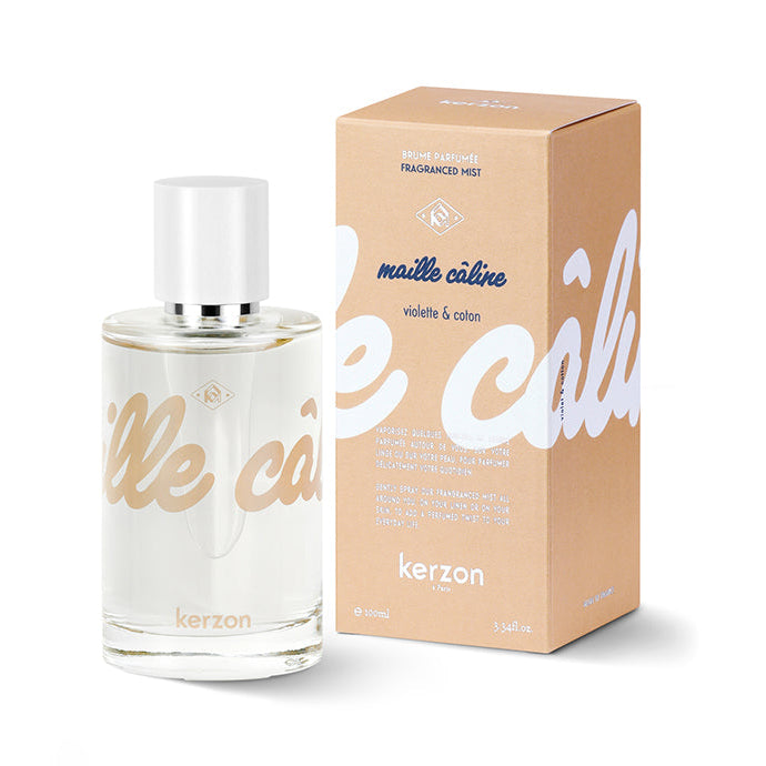 A bottle of Kerzon Maille Câline fragranced mist with its packaging box, featuring a clean and minimalist design in beige and white colors with golden text.