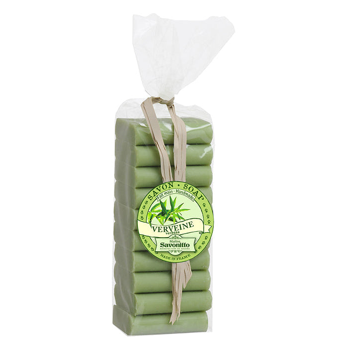 A pack of artisanal verbena-scented guest soaps, wrapped in green cloth and tied with a string, with a label on the front.