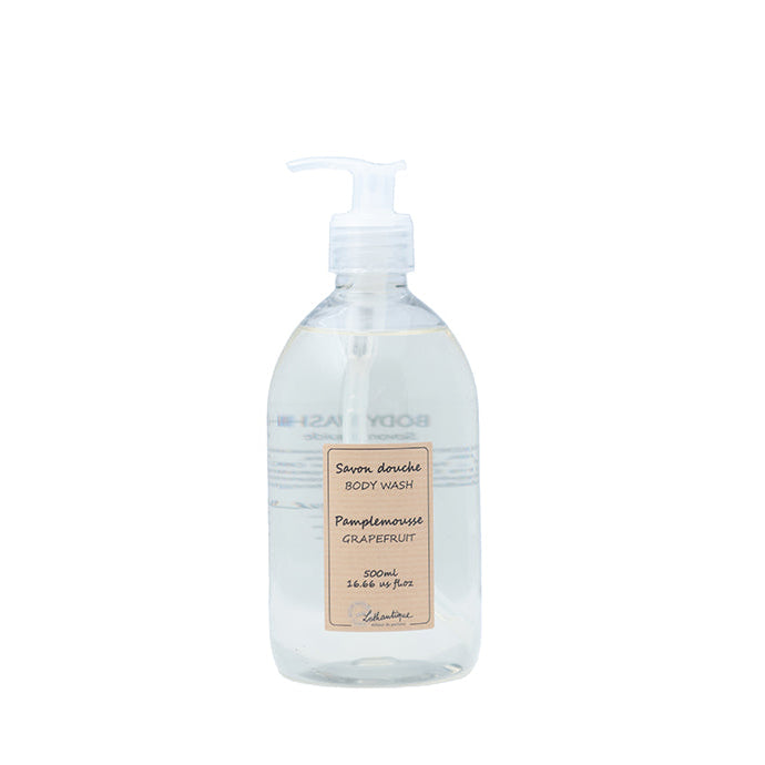 A clear plastic bottle with a pump dispenser, labeled as Authentique Grapefruit Body Wash.