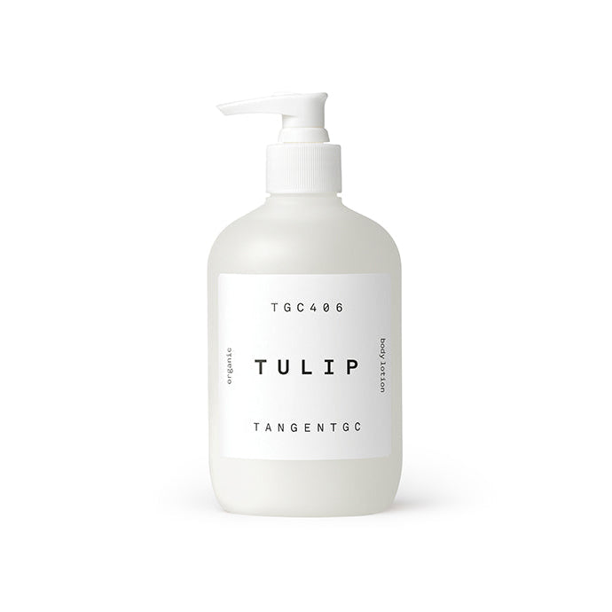 A white pump bottle labeled 'TULIP' by Tangent GC, containing body lotion.