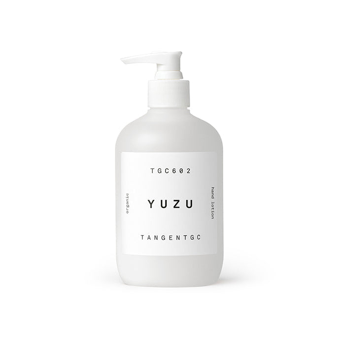 A white pump bottle labeled 'YUZU TANGENT GC